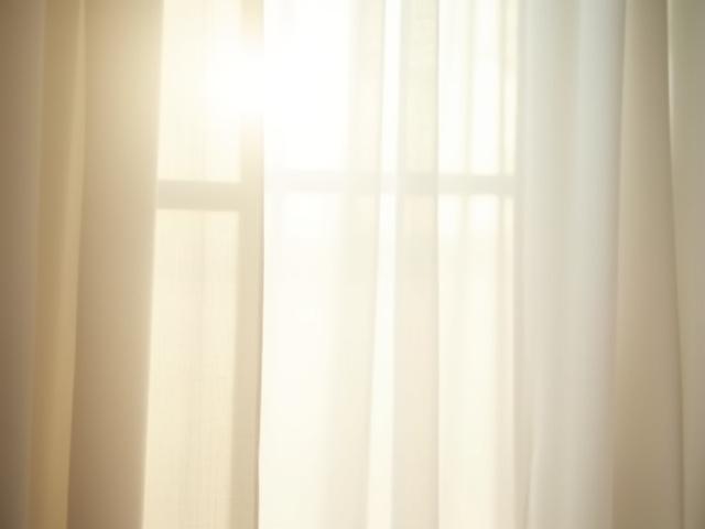 Lightweight sheer linen curtains that maximize natural light.